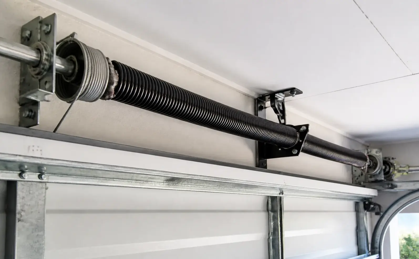 Garage door spring repair and torsion spring system
